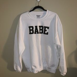 White “BABE” sweater